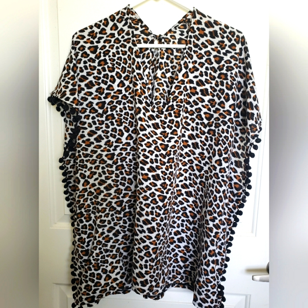 Leopard Print Poncho with Pom Pom Trim.